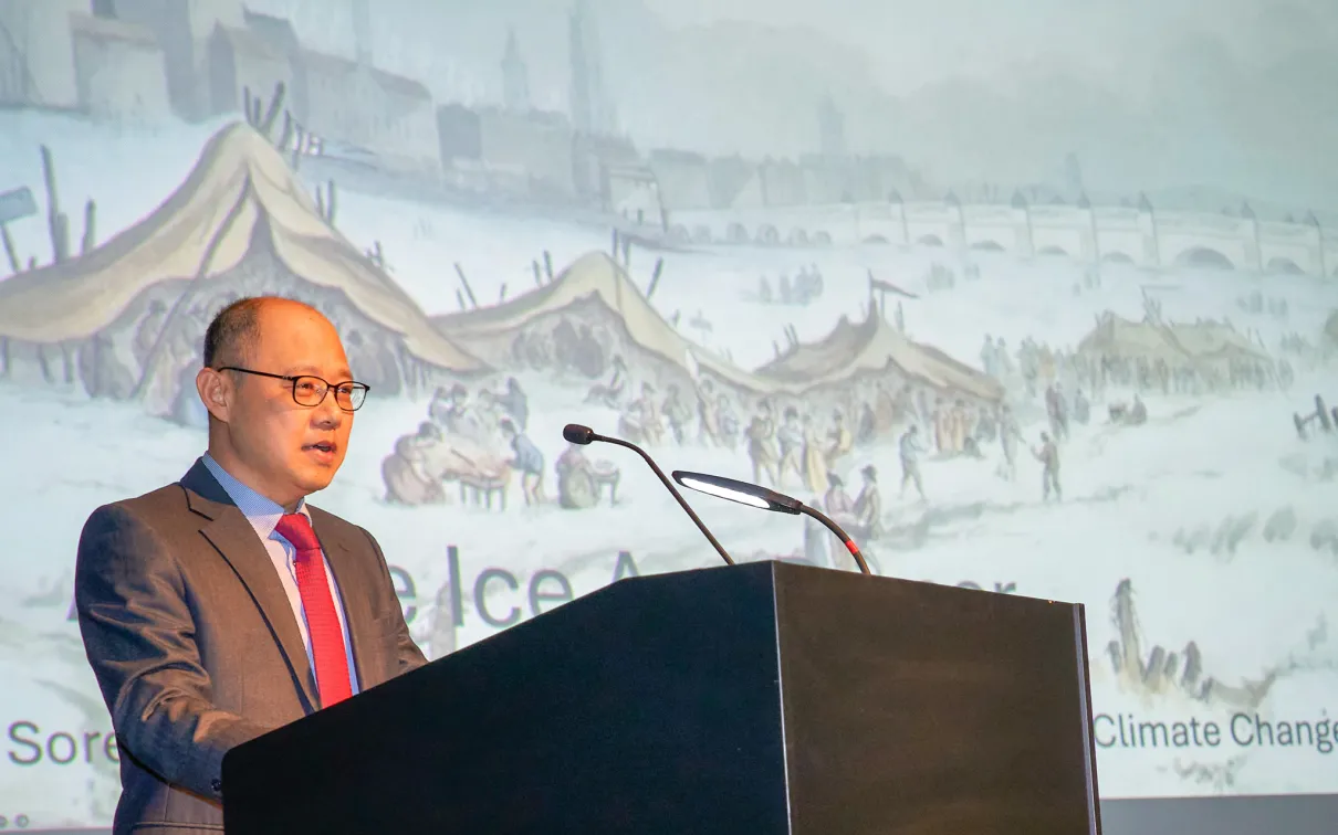 Man speaking at a podium