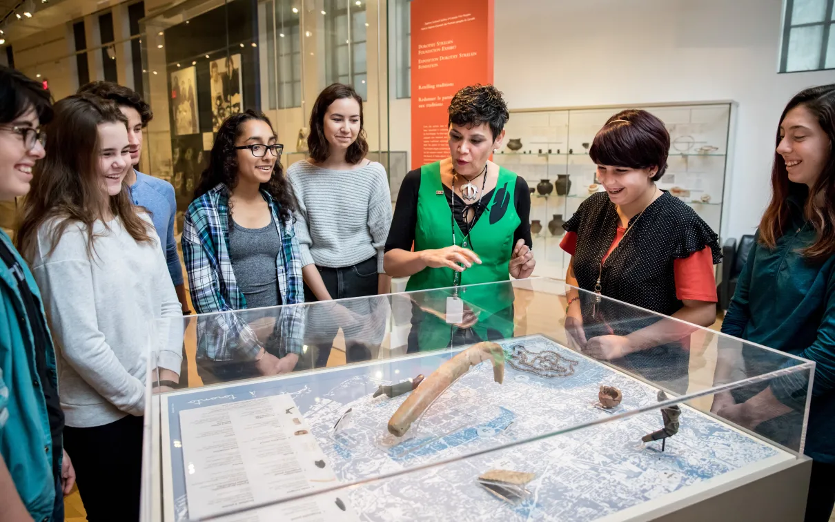 Instructor explaining collection item to students