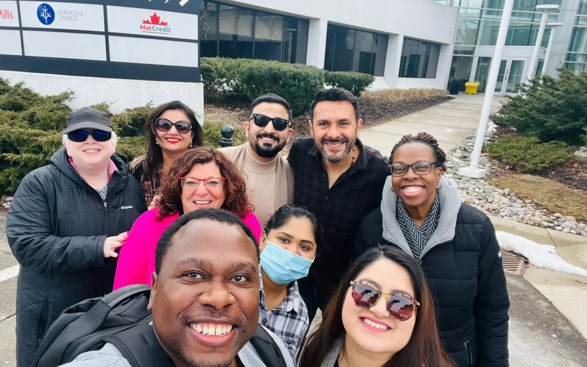 A group of diverse people taking a picture for the camera.