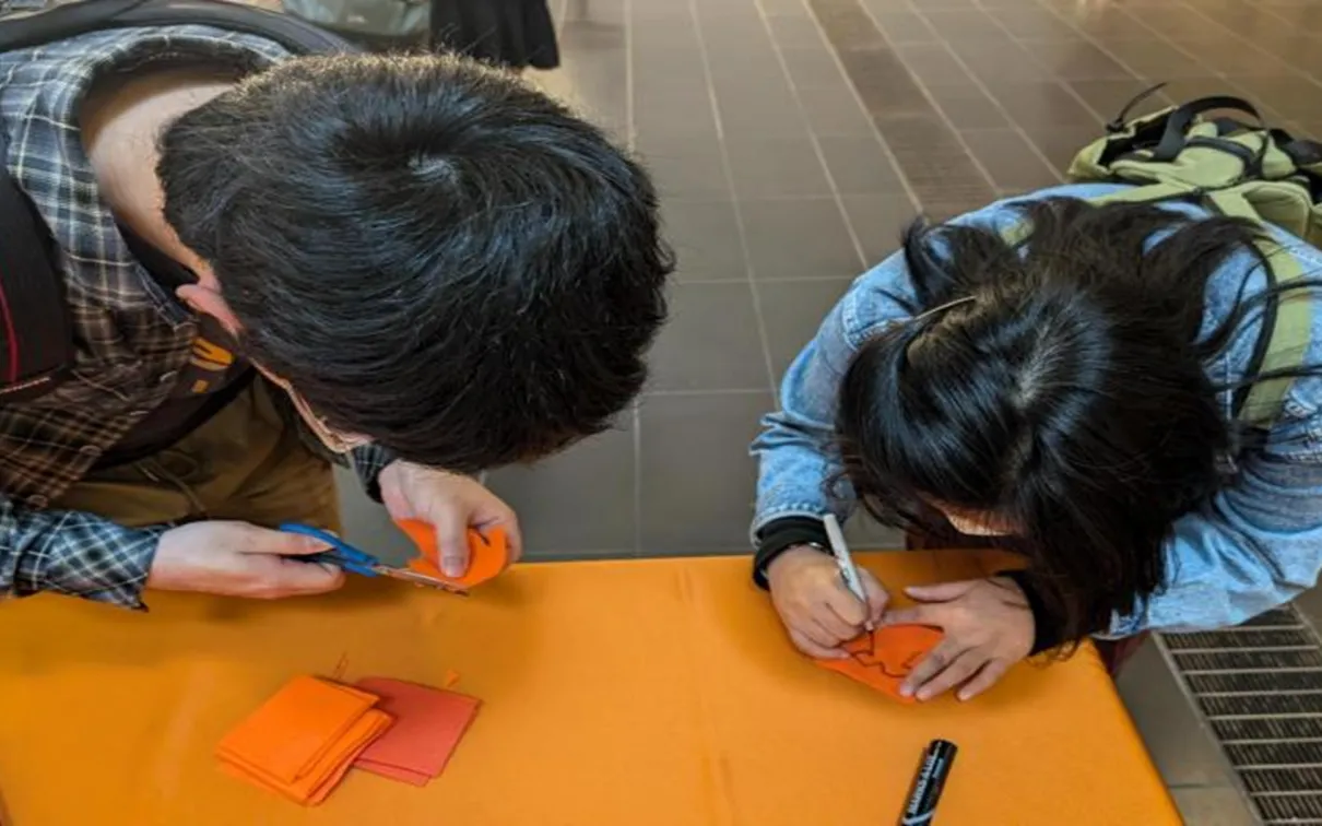 2 students doing arts and crafts