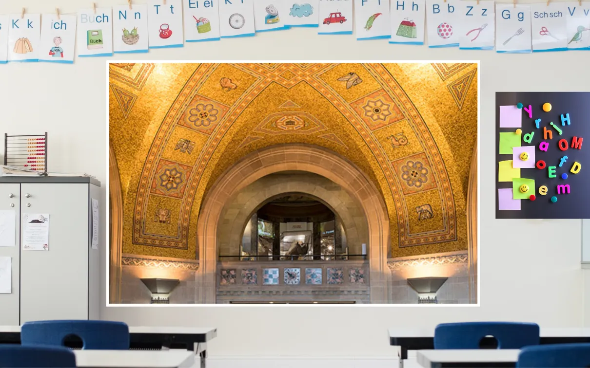 Exploring the ROM A screen in a classroom displays an image of a golden mosaic ceiling surrounding an arched balcony, through which a rhino in a case can be seen