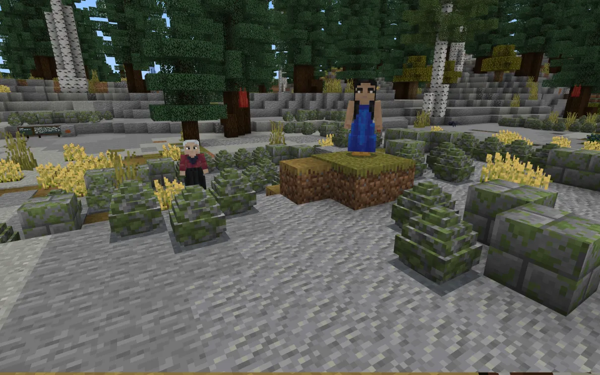 A Minecraft screenshot of an Indigenous woman in a blue dress with dark hair, and an Indigenous woman in a red dress with white hair, standing in amongst rock formations.