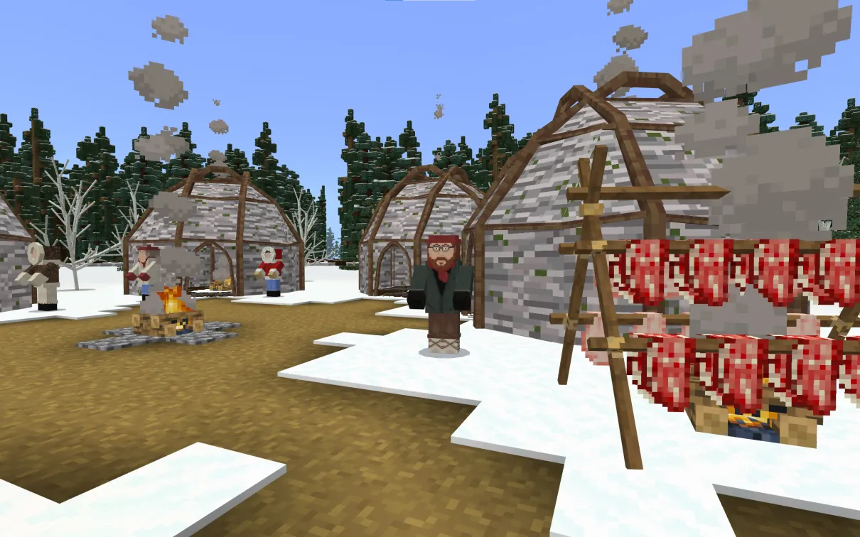 A Minecraft screenshot of a campsite in a winter forest. Several birchbark wiigwaams are set around a central fire. To one side, meat on racks cures over a fire. Several Elders dressed in warm winter clothing stand outside the wiigwaams.