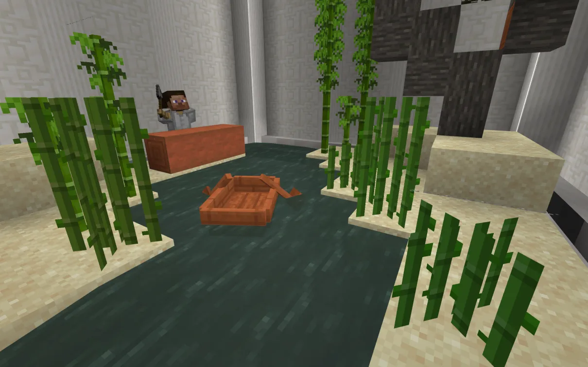 A Minecraft screenshot of a figure holding an axe next to a large log on a riverbank. A boat floats on the river next to him.