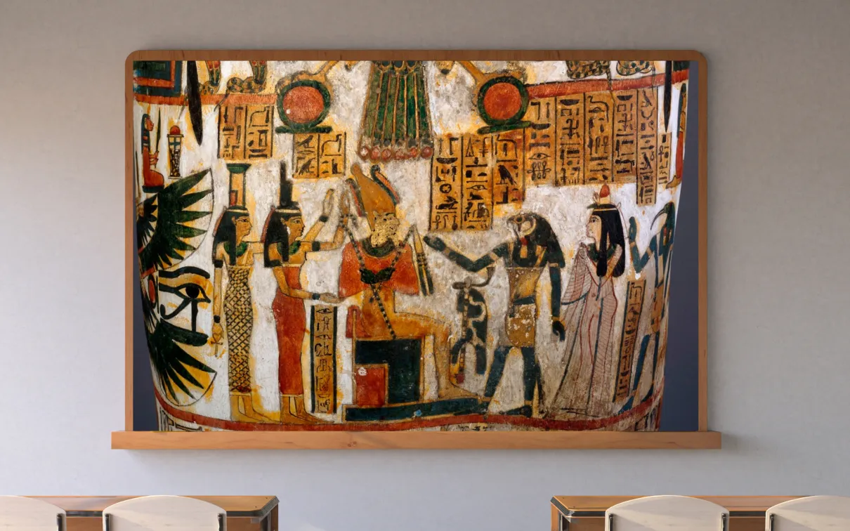 A screen in a classroom displays a scene from an ancient Egyptian coffin with hieroglyphs.