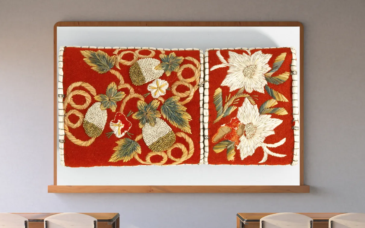 A screen in a classroom shows an image of beaded strawberries against a red background.