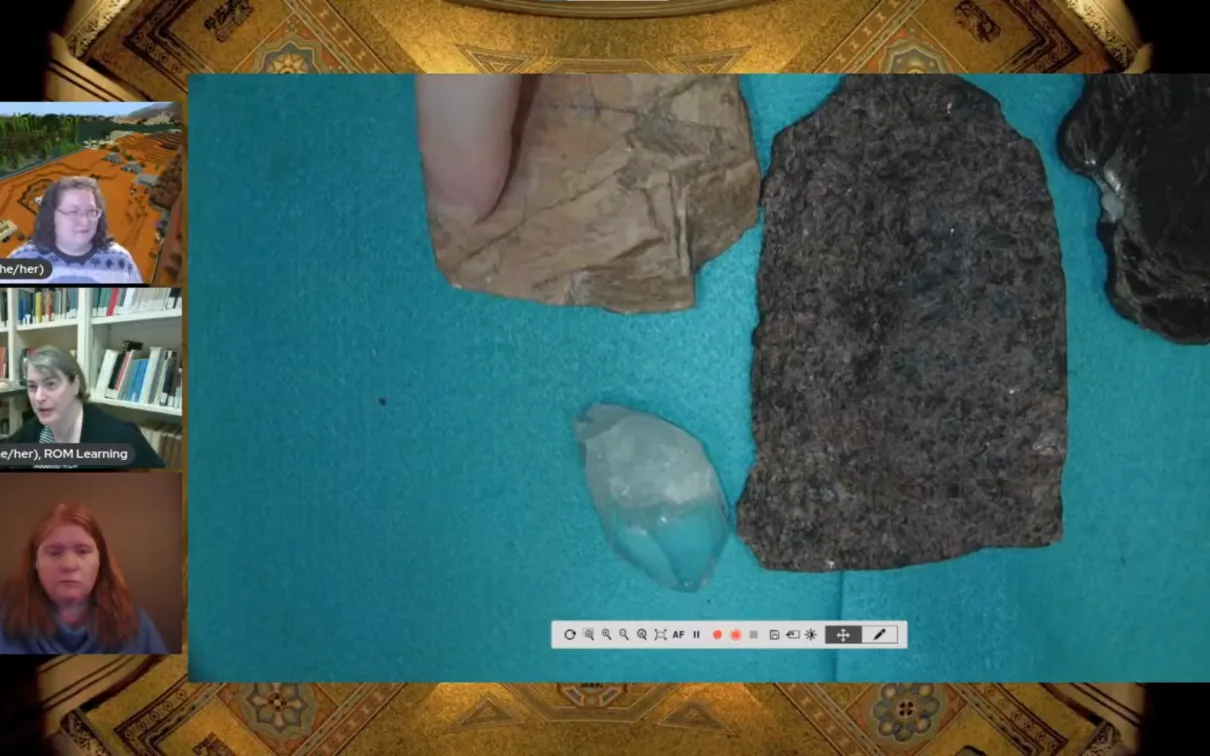 A desktop camera shows pieces of pink feldspar, black mica, white quartz, and granite containing a mix of those three colours.