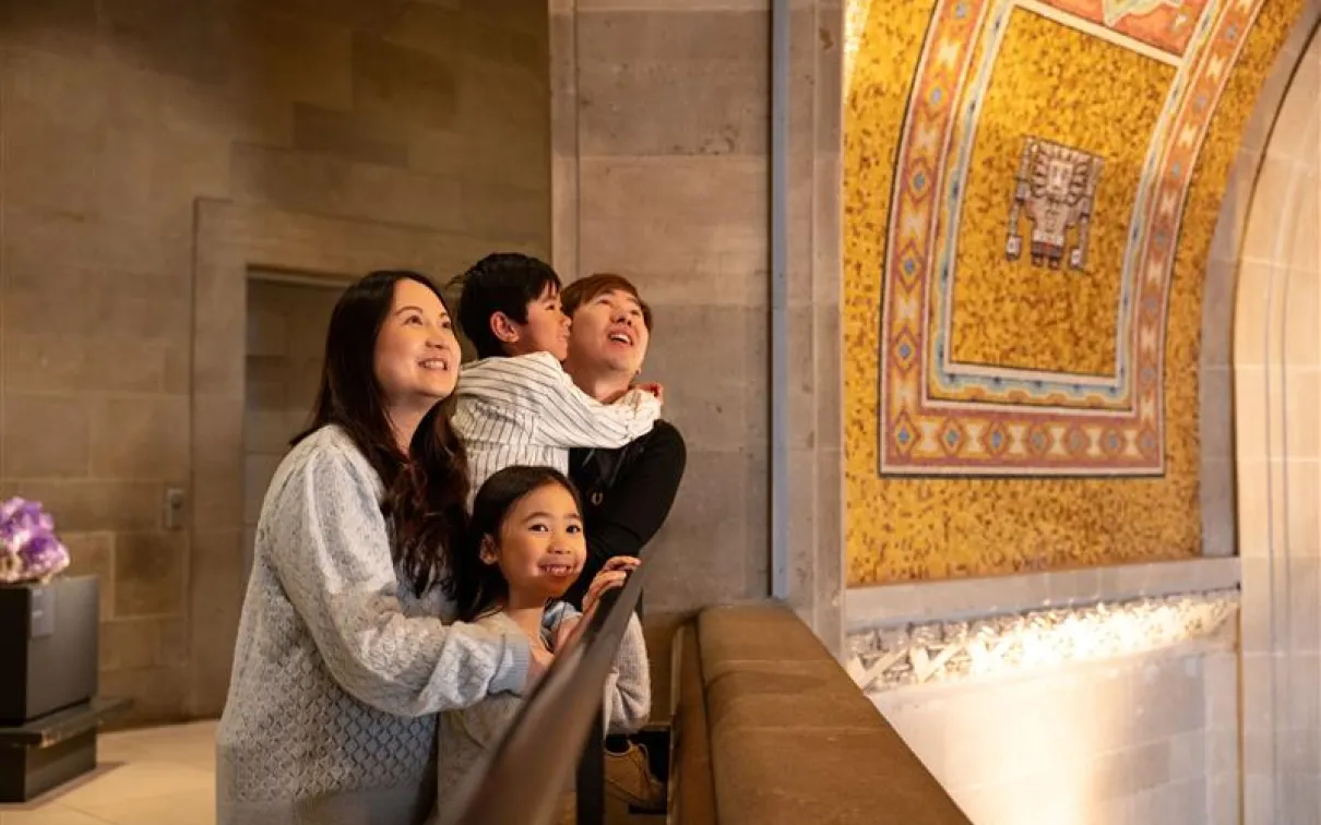 Family looking up at the Rotunda ceiling. 