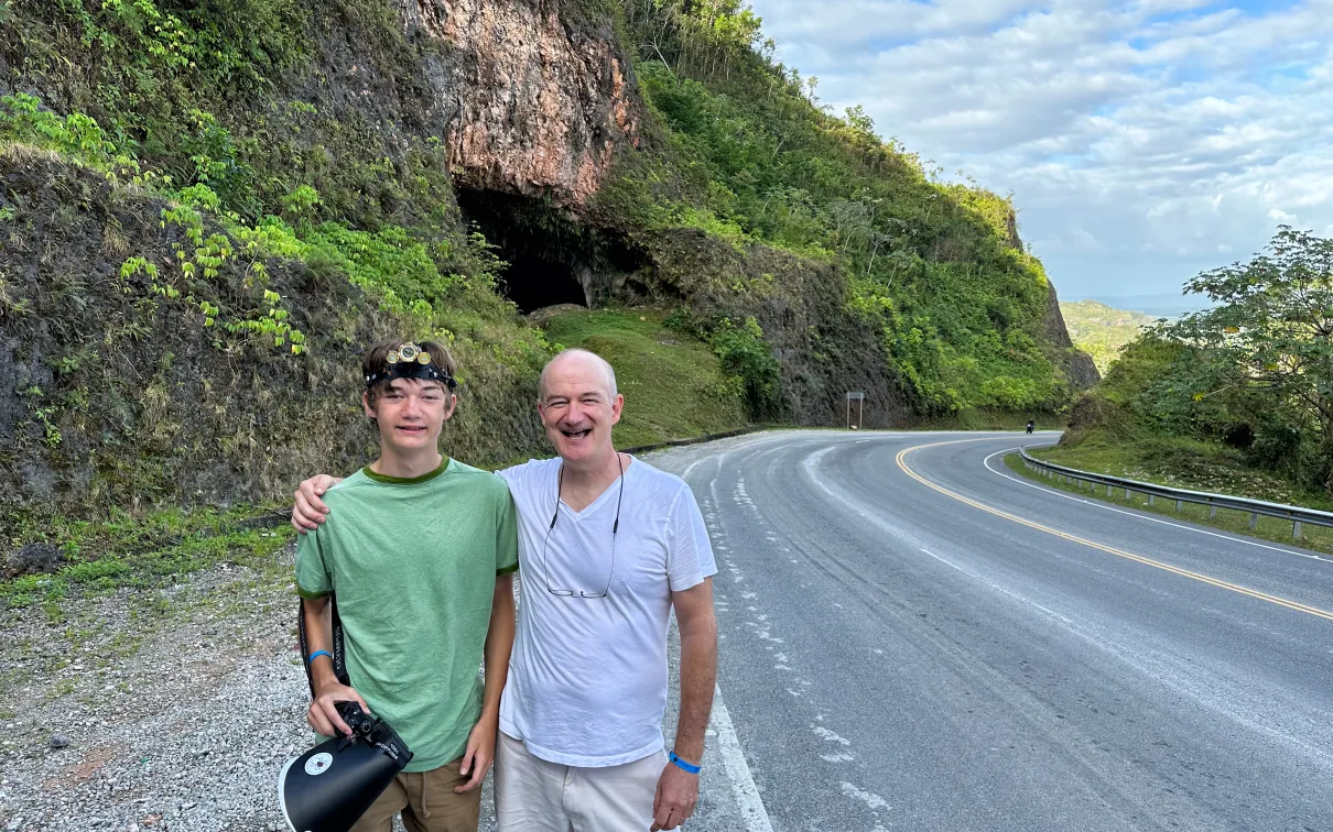 Beckett Robertson and his father, Blair, pose outside the Cueva Boulevard del Atlántico. (2023)