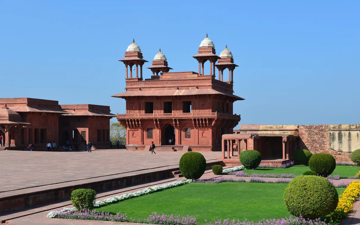 A building with a lawn on the foreground