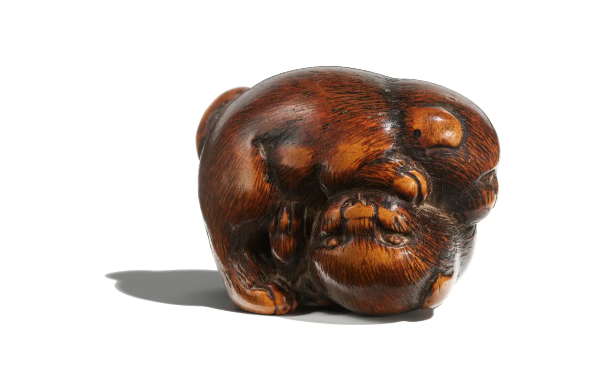 Small netsuke of two puppies