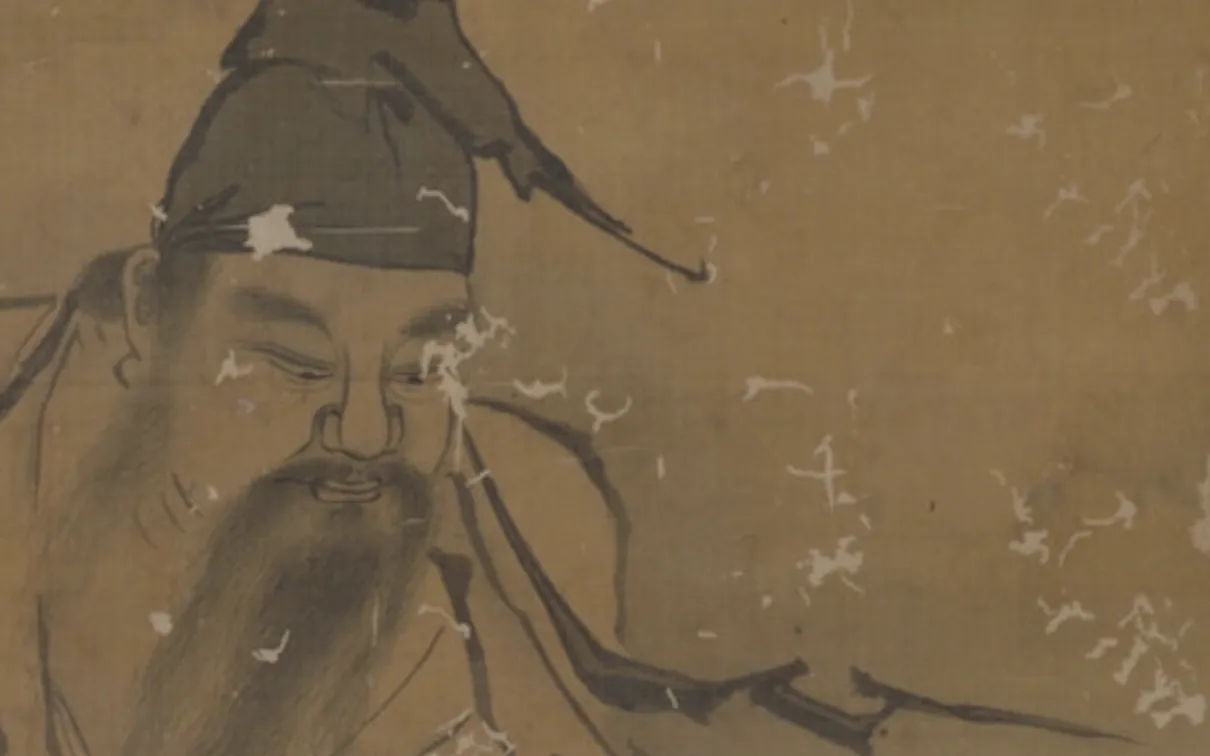 Vertical ink-and-wash painting on a tan, aged scroll. Two human figures in flowing robes are shown outdoors among grasses and rocks; one figure stands or leans forward holding long, leafy branches, while another figure crouches below with a hunched posture. The style is monochrome linework with light ink washes, visible wear, and scattered patches of abrasion across the surface.