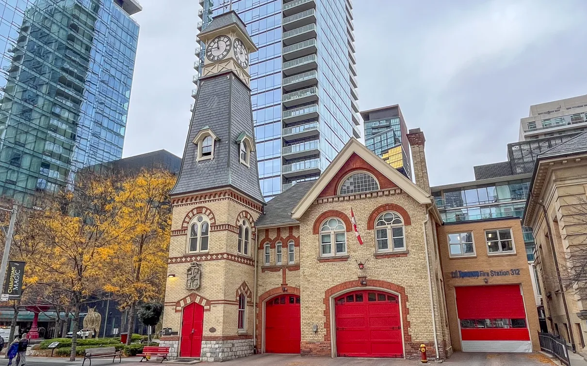 street view of firehall with red doors in foreground