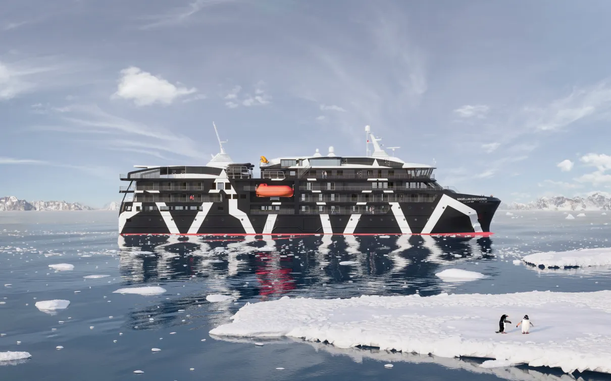 : An ice-class cruise ship, sailing serenely through a frosty, cloud-strewn ocean.