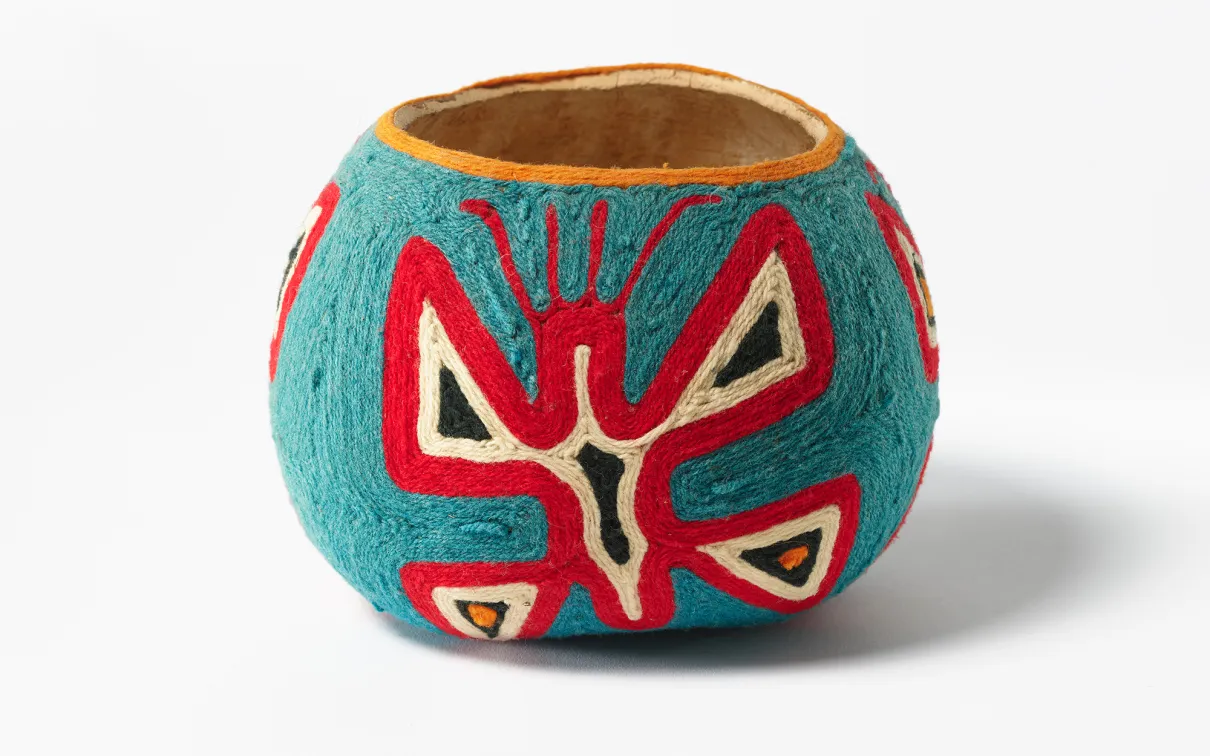 A decorated gourd made by a Huichol artist