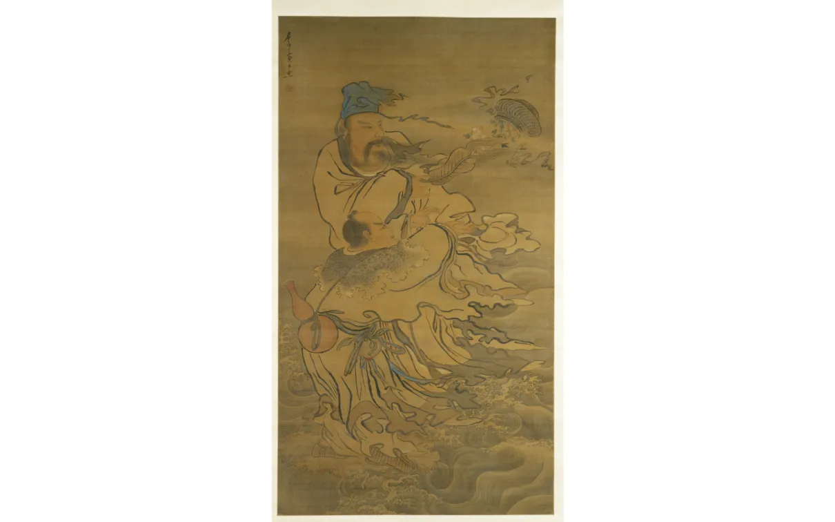 Vertical hanging scroll painting depicting two robed figures amid swirling water and wind. A taller figure stands above, wearing layered robes and a head covering, with long ribbons and sleeves flowing outward. Below, a smaller figure is carried or supported, partially wrapped in the taller figure’s garments. Waves and curving lines fill the lower half of the composition, suggesting movement through water, while fish-like forms and drifting elements appear near the upper right. The artwork is rendered in mu