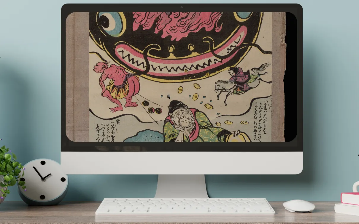 A desktop monitor displays a print of a giant koi