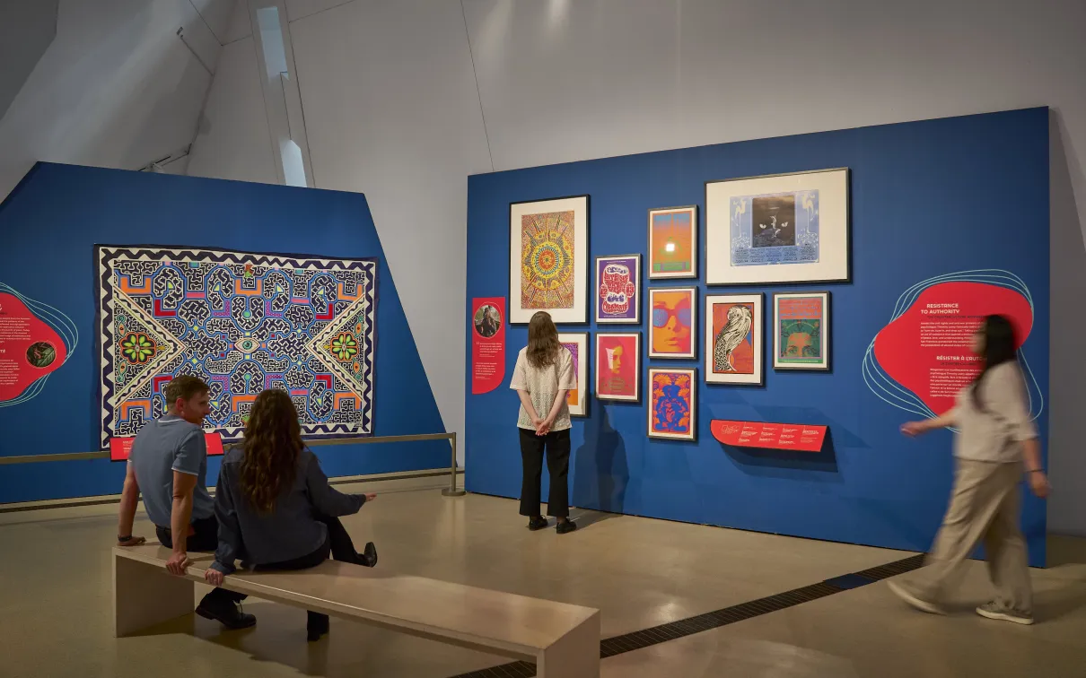 image of four people inside exhibition space