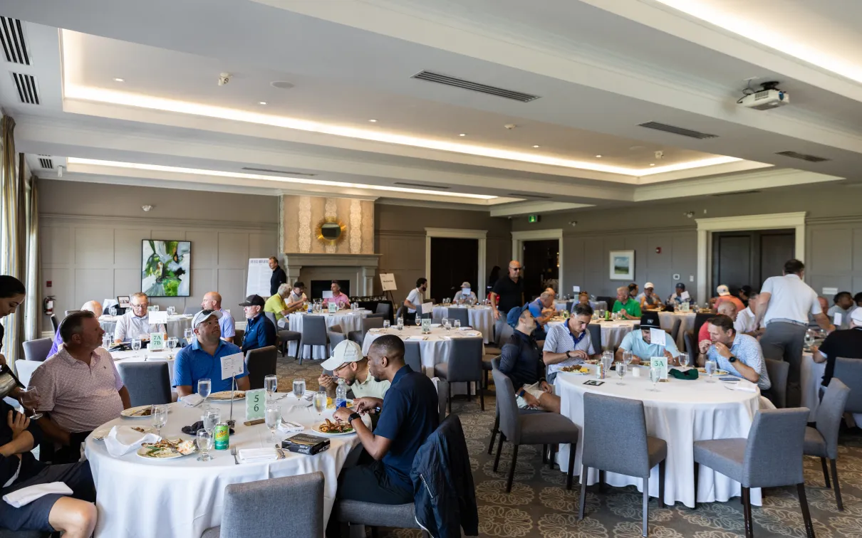 Players sitting down for lunch at the reception. 