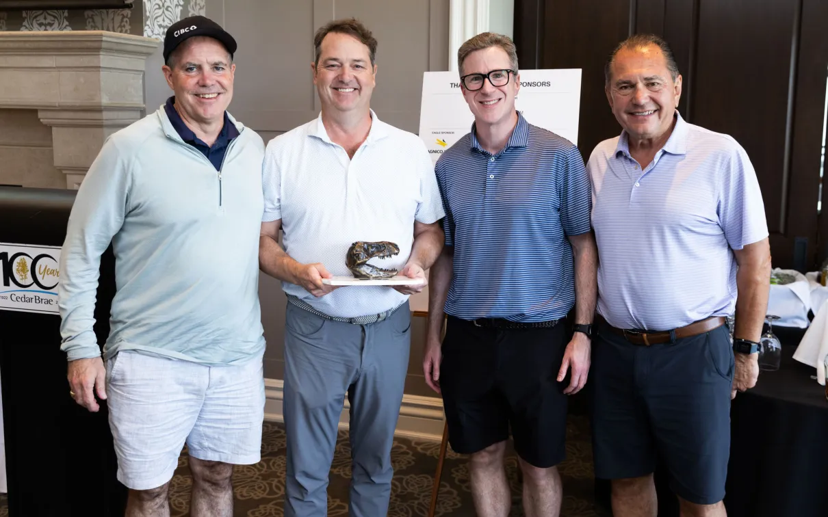 CIBC 10th Annual Driving Impact Award Winners holding the award. 