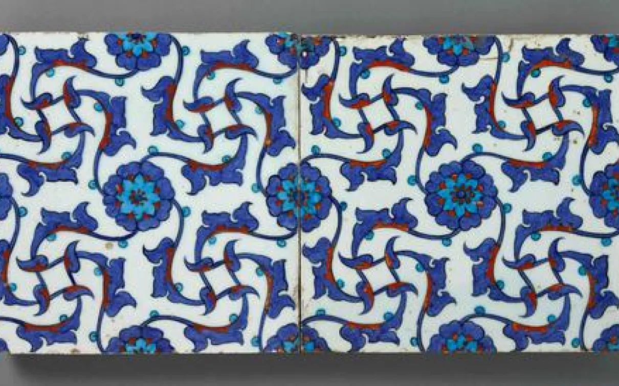 Tiles showing repeated floral and vine patterns