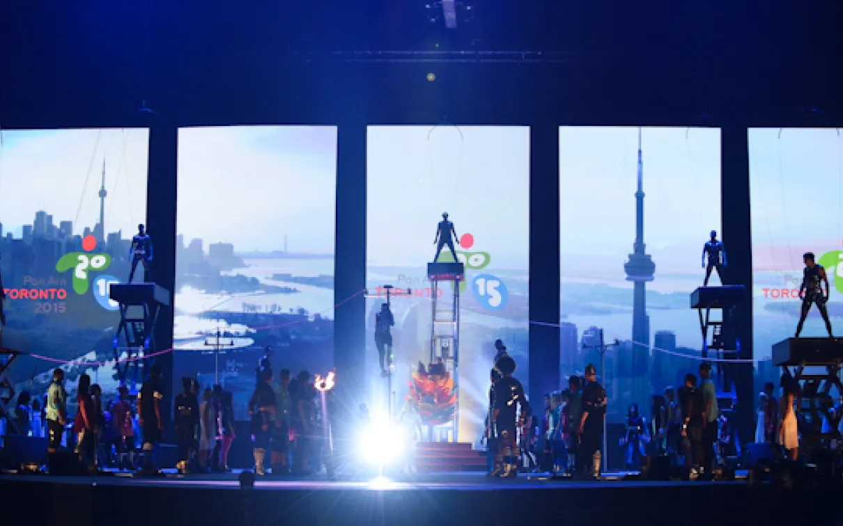 A stage performance with images of Toronto in the background for the opening ceremonies of the 2015 Pan Am Games in Toronto
