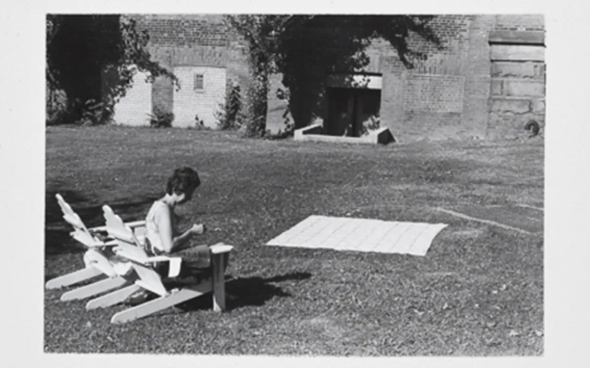 Judy drying a coverlet in the ROM garden
