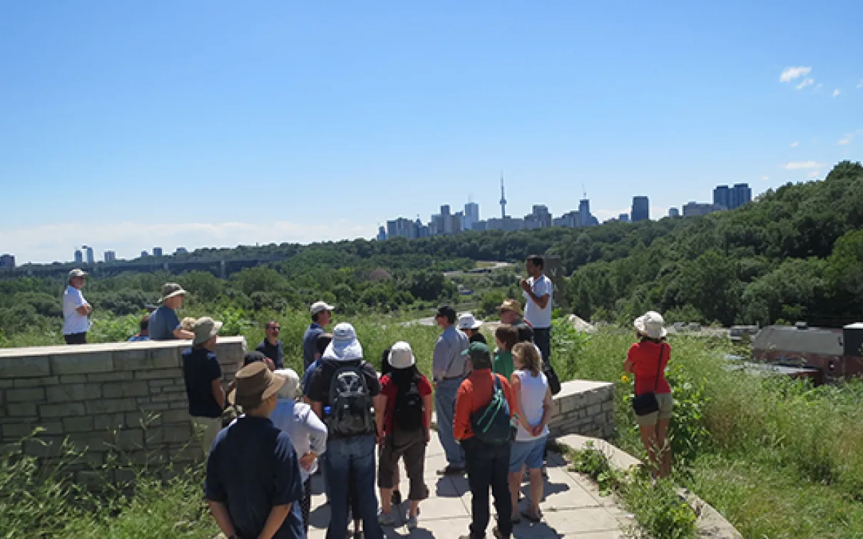 Group stands with Toronto skyline in Background
