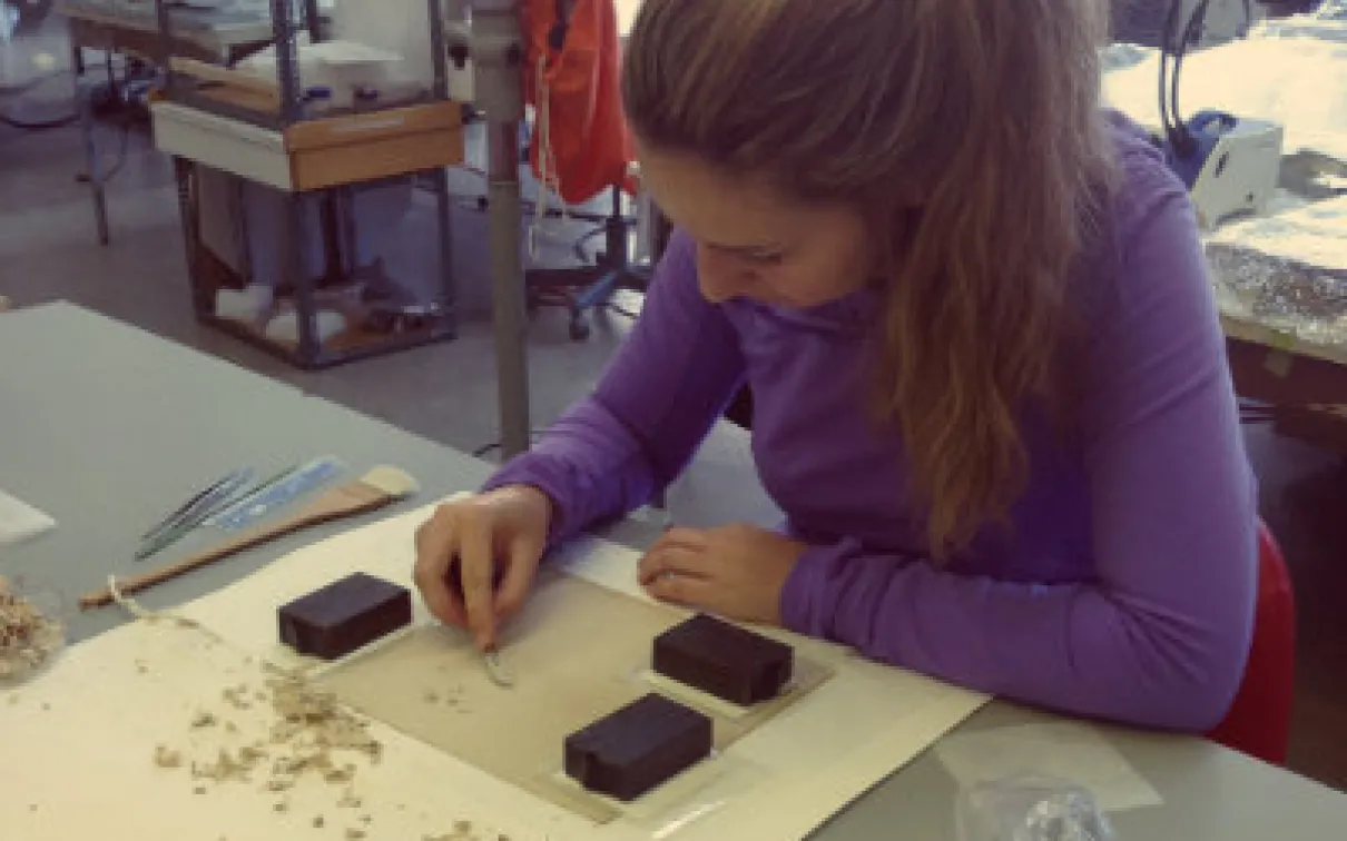 Natasa performing backing removal on an albumen photograph at her bench in the Queen’s conservation lab. Photo courtesy of Natasa Krsmanovic.
