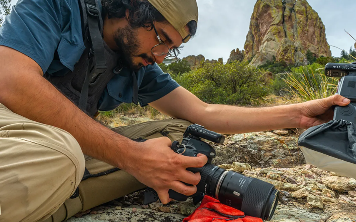 In the Chiricahua Mountains of Arizona, Nick Kanakis prepares to shoot a jumping spider. Photo credit: Javier Aznar.