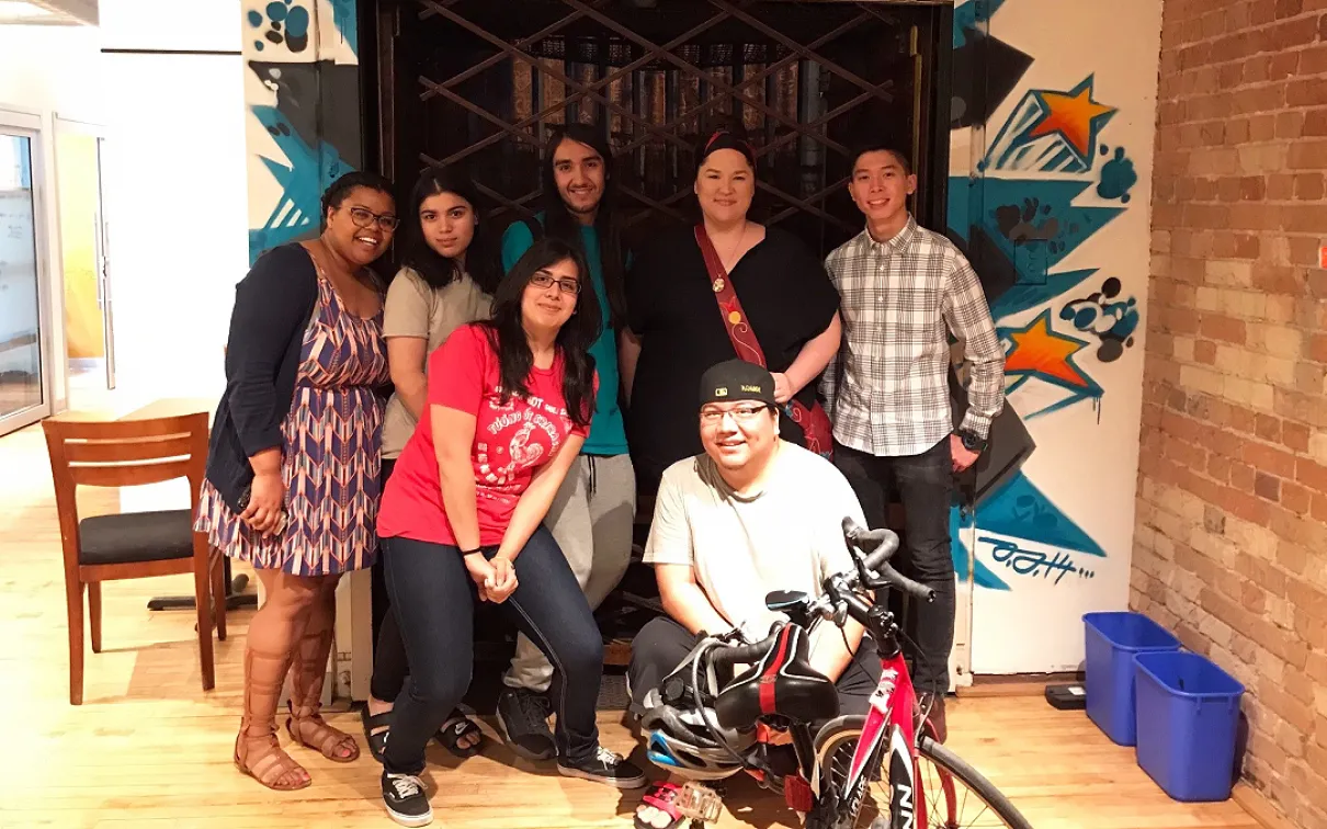 A group of Youth Cabinet members pose in front of a graffiti wall the Wattpad office with Lindy Kinoshameg and Wattpad's Talent Manager I-Yana Tucker in 2018.