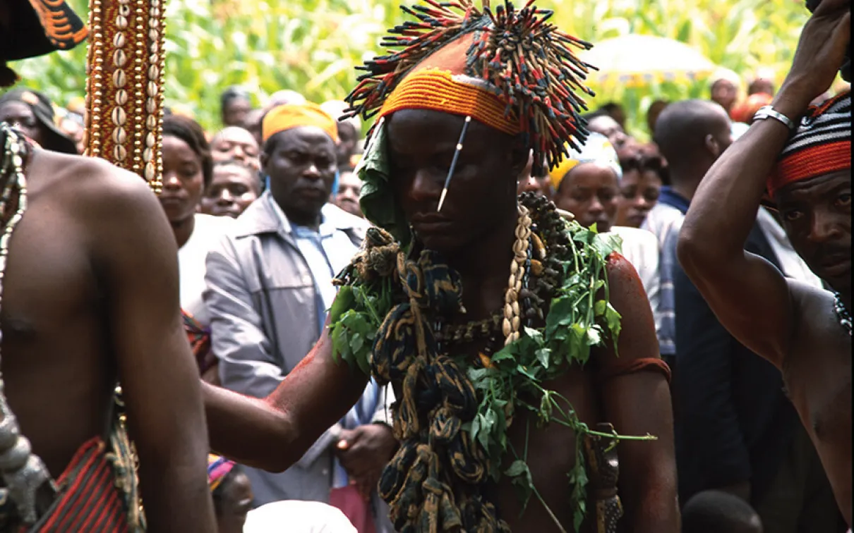Person wearing a porcupine quill cap.