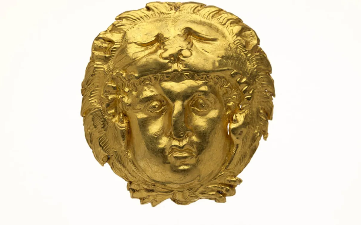 Appliqué in the form of a head of Herakles.