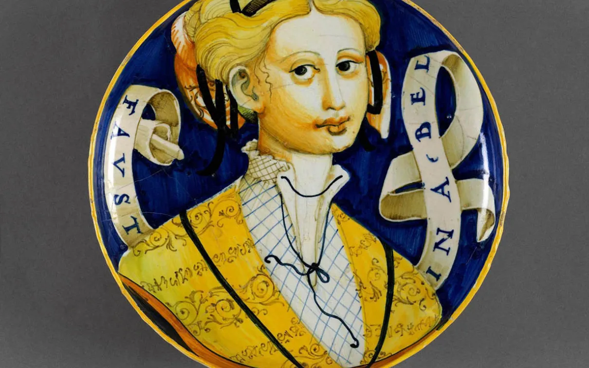 Italian pottery plate with a woman painted on it.