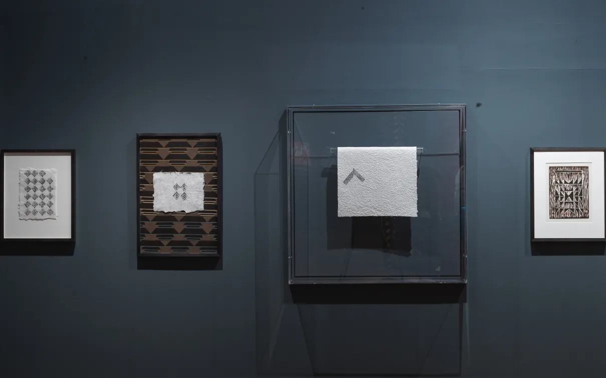 View of framed works on handmade khadi paper displayed in the exhibition Swapnaa Tamhane: Mobile Palace, at ROM.