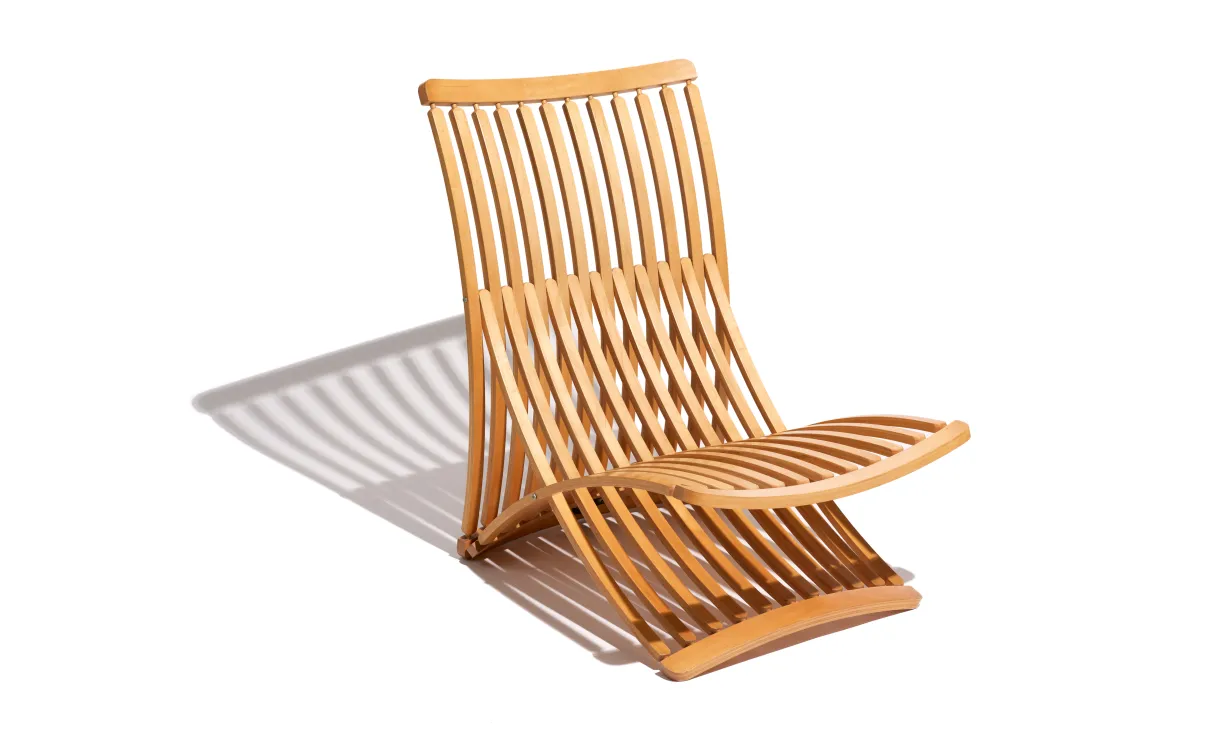  Armless chair made of multiple, steam-bent wooden slats.