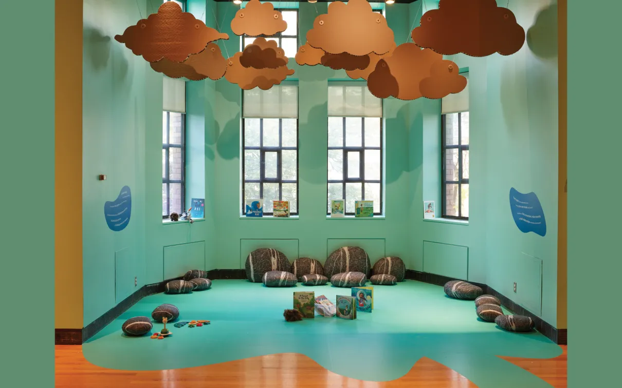 WonderWorks' story nook creates a calm oasis of learning engagement, full of books, clouds, and pillows.