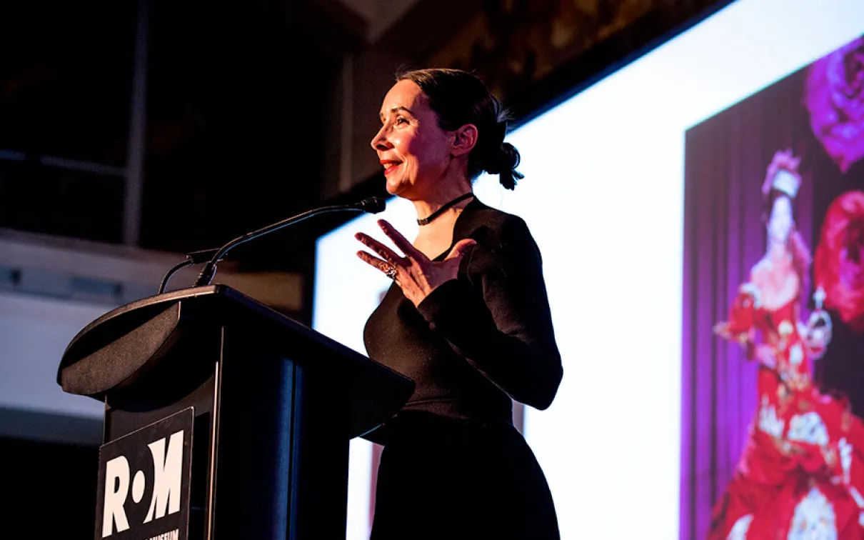 Woman speaking on stage

