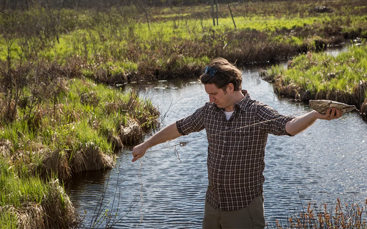 Sebastian Kvist setting a leech trap in Lake Vermilion.
