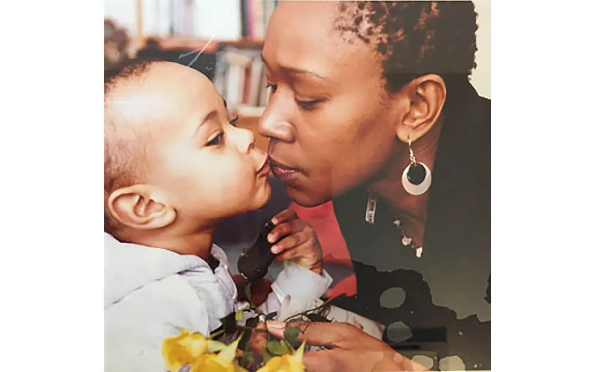 Teo kissing her son, Matthew.