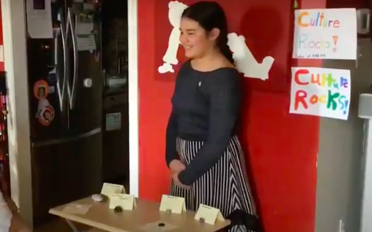 Girl shows her personal museum to her family.
