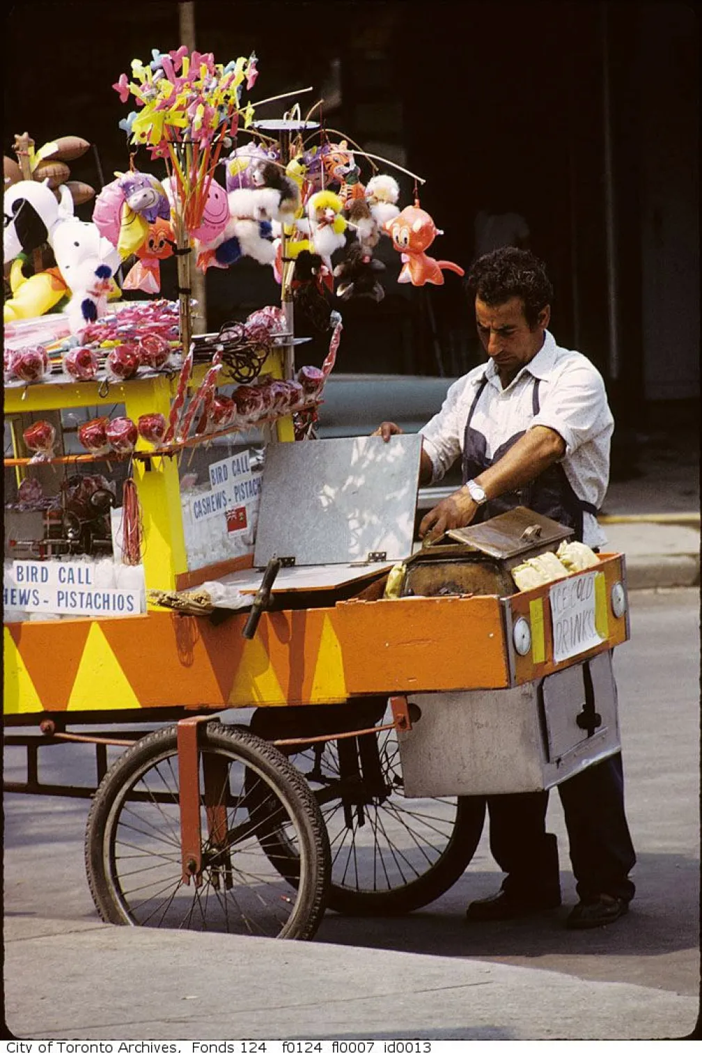 A person making popcorn in a cart.