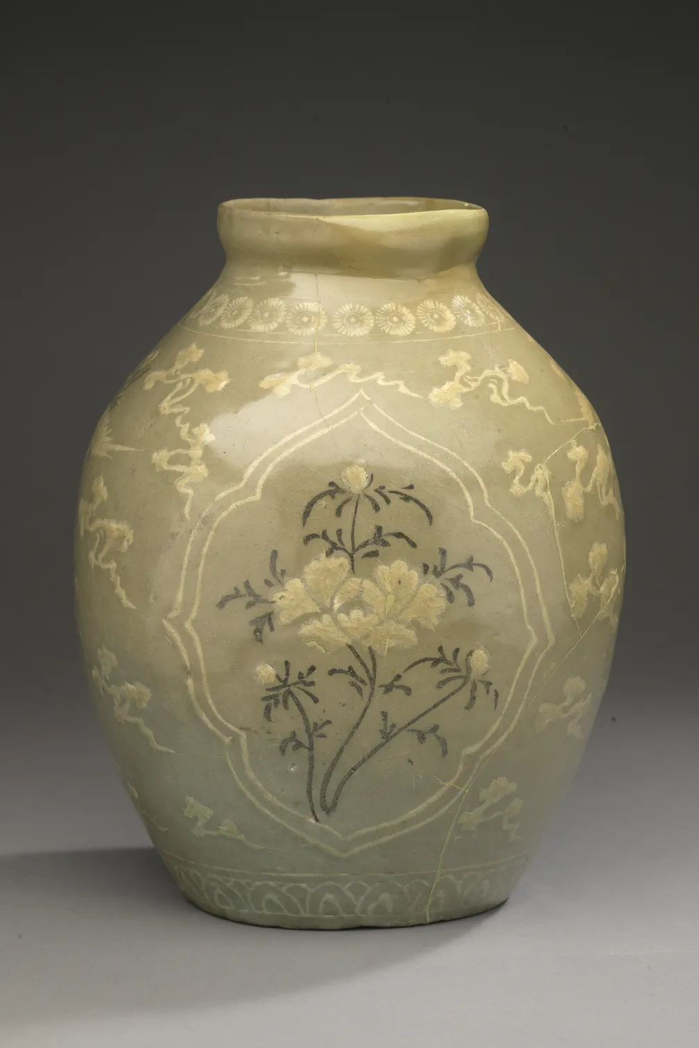 Late 13th to early 14th century Goryeo Period Celadon Jar with Inlaid Peony, Cloud, and Crane Design 청자상감 모란운학문 편호, wheel-thrown stoneware with inlaid designs under celadon glaze, Korea, 910.40.5. © ROM and Gift of Sir Edmund Walker.