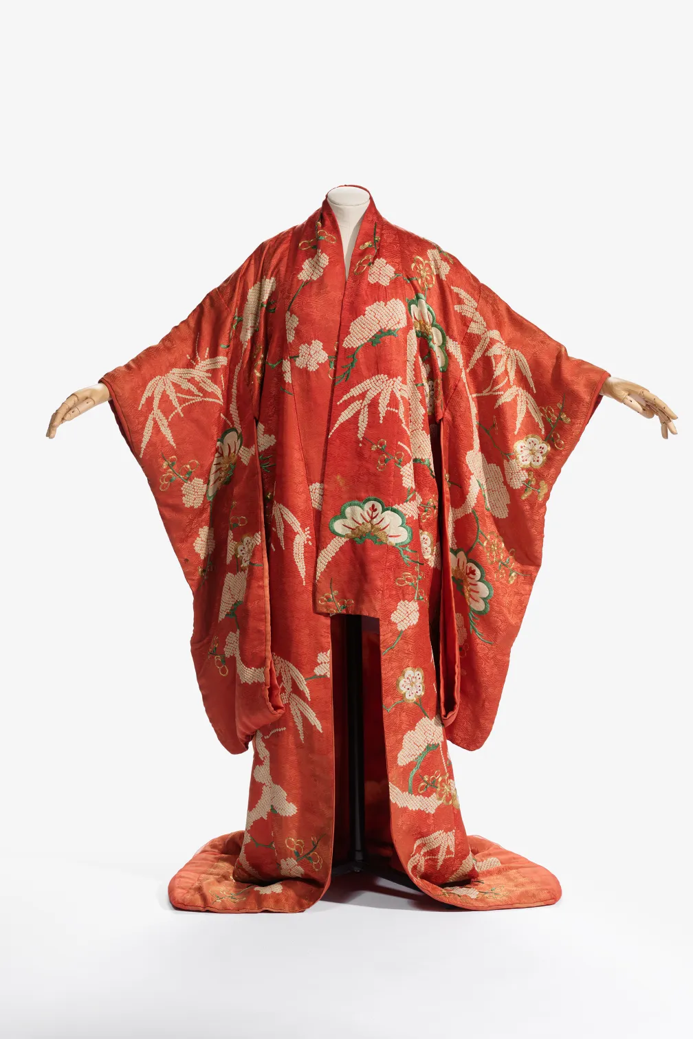 red kimono draped on mannequin 