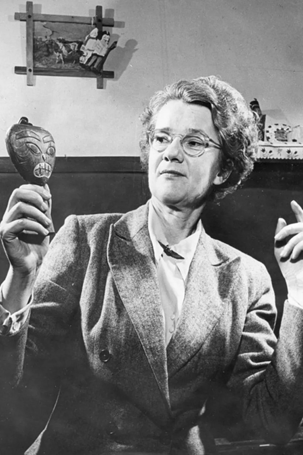 Ella Martin displays an artifact.