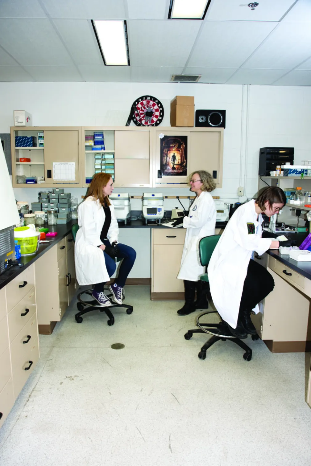 Three women in a lab running DNA testing
