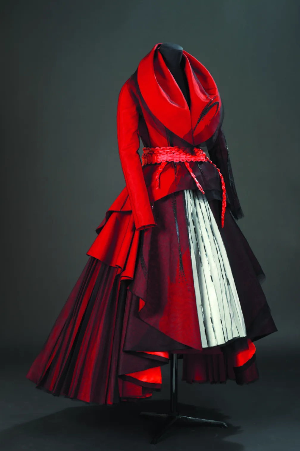 Red dress with white panels and black beaded designs
