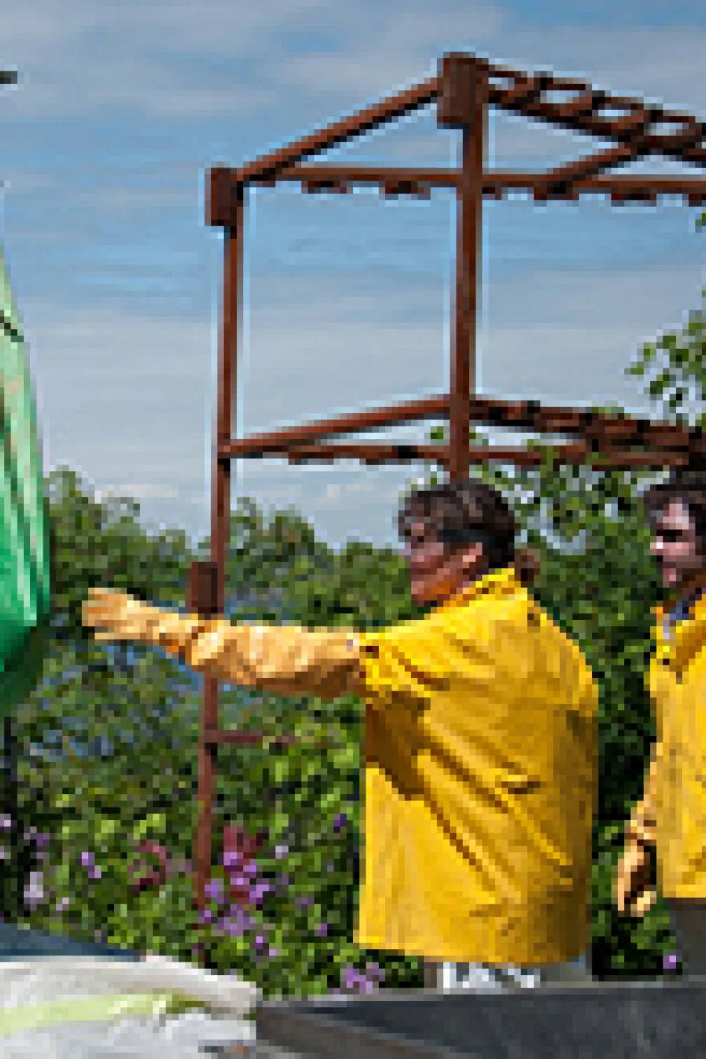 Blue whale with workers on the coast
