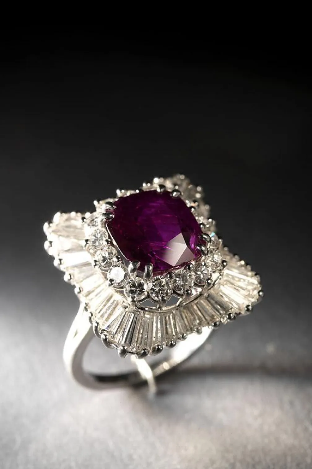 Ruby (6.00 carats by gauge) set in platinum with mixed cut diamonds (rounds and baguettes) in a ballerina setting
