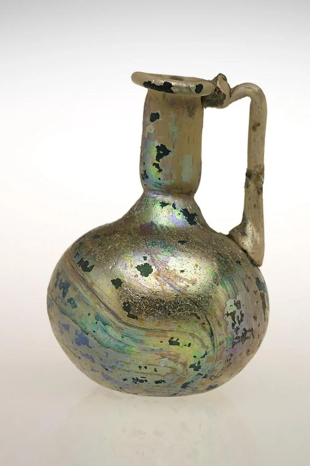 One handled flagon, blown glass with trailed handle.